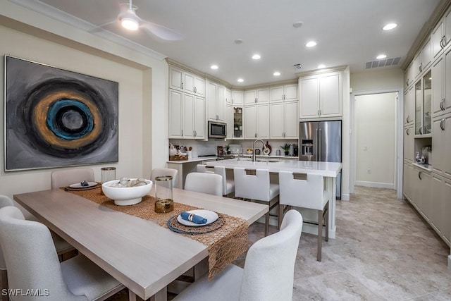 dining space featuring recessed lighting, visible vents, ceiling fan, and ornamental molding