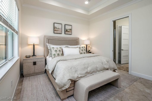 bedroom featuring recessed lighting, baseboards, crown molding, and a tray ceiling