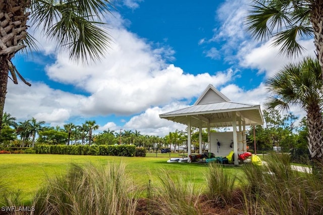 view of home's community featuring a lawn