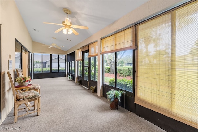 sunroom with visible vents and lofted ceiling