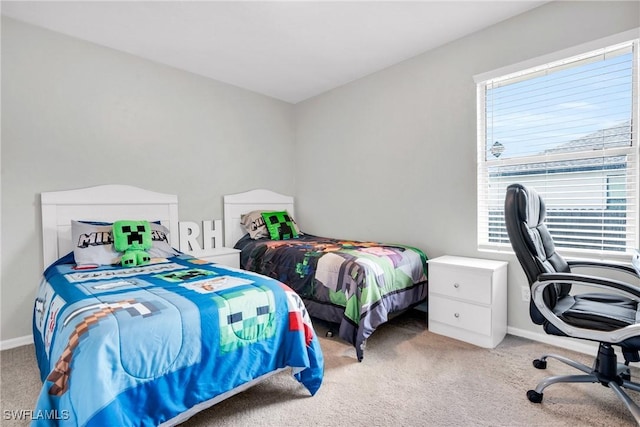 carpeted bedroom with baseboards