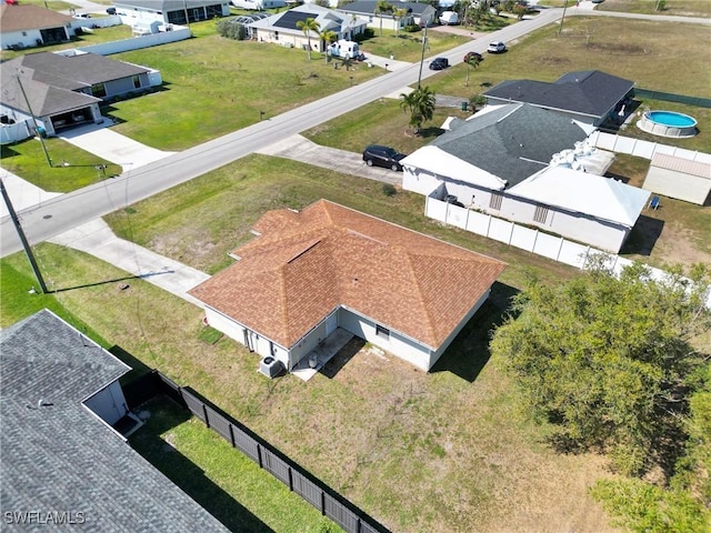 birds eye view of property with a residential view