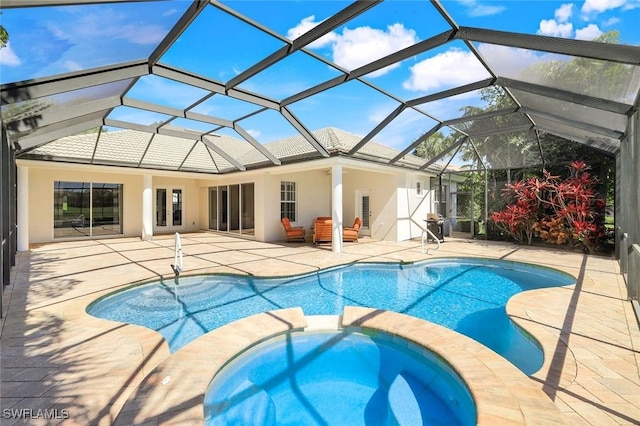 view of swimming pool featuring a patio area, french doors, and a pool with connected hot tub