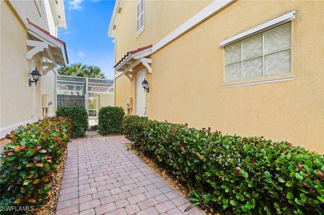 view of patio with a lanai