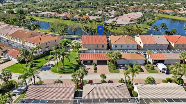 aerial view with a residential view and a water view