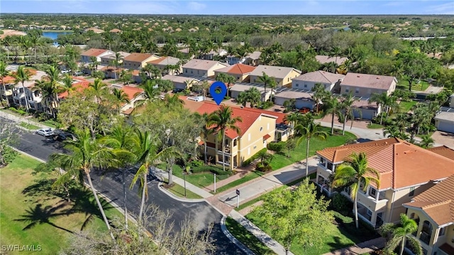 birds eye view of property featuring a residential view and a water view