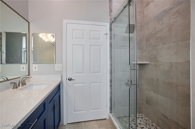 3381 Mystic River Dr, Naples, FL 34120 - bathroom featuring vanity, tile patterned floors, and a stall shower