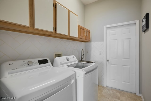 3381 Mystic River Dr, Naples, FL 34120 - washroom with washer and clothes dryer, cabinet space, and a sink