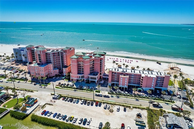 bird's eye view featuring a beach view and a water view