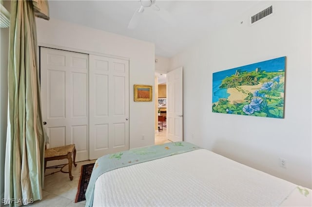 bedroom featuring visible vents, a closet, and ceiling fan