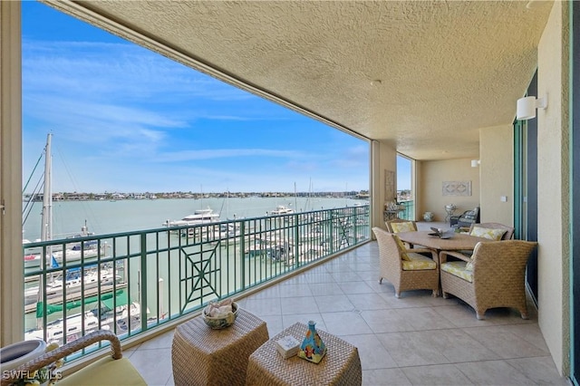 balcony featuring a water view