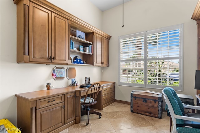 12922 Kedleston Cir, Fort Myers, FL 33912 - office featuring built in desk, light tile patterned floors, and baseboards