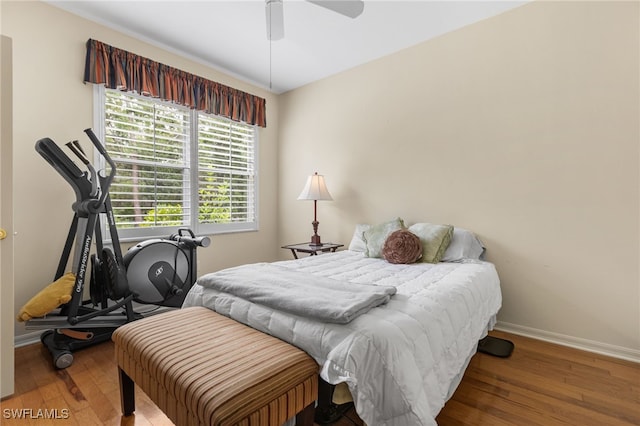 12922 Kedleston Cir, Fort Myers, FL 33912 - bedroom with baseboards, wood finished floors, and multiple windows