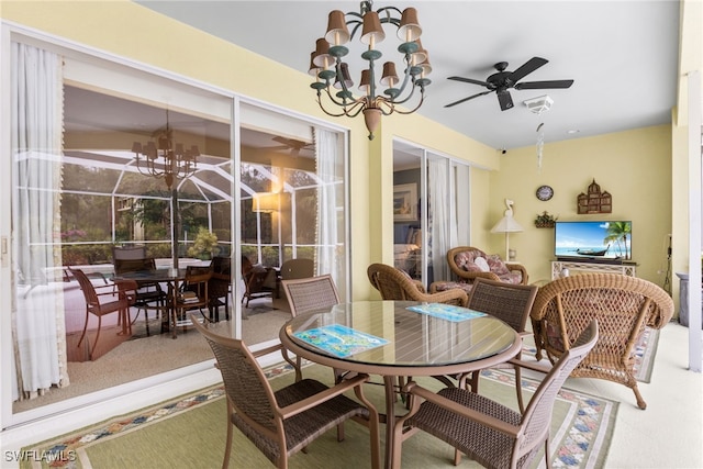 12922 Kedleston Cir, Fort Myers, FL 33912 - dining room with ceiling fan, a chandelier, and plenty of natural light