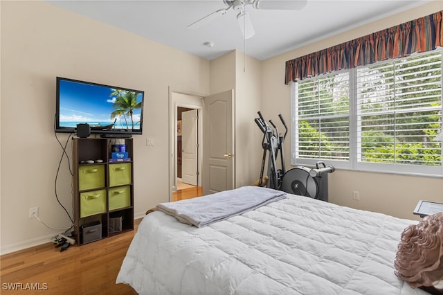 12922 Kedleston Cir, Fort Myers, FL 33912 - bedroom featuring wood finished floors, baseboards, and a ceiling fan