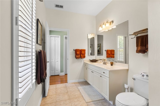 12922 Kedleston Cir, Fort Myers, FL 33912 - bathroom with toilet, vanity, tile patterned flooring, and baseboards