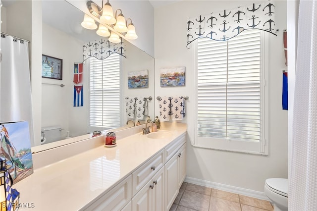12922 Kedleston Cir, Fort Myers, FL 33912 - full bathroom featuring toilet, a chandelier, tile patterned floors, vanity, and baseboards