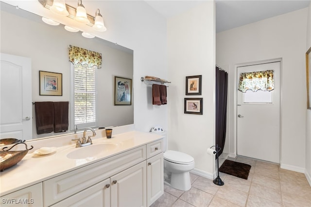 12922 Kedleston Cir, Fort Myers, FL 33912 - bathroom featuring healthy amount of natural light, toilet, vanity, and tile patterned flooring