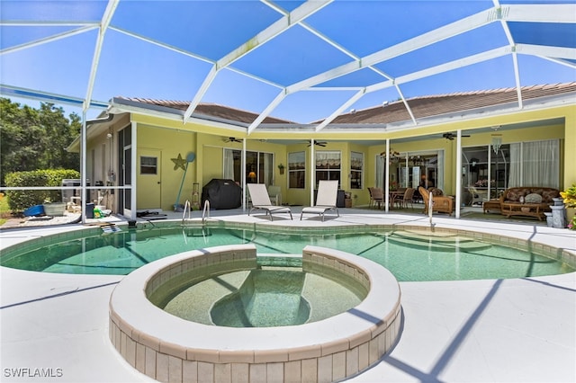 12922 Kedleston Cir, Fort Myers, FL 33912 - view of swimming pool featuring a ceiling fan, a pool with connected hot tub, a patio, and a lanai