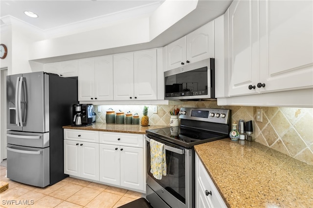 12922 Kedleston Cir, Fort Myers, FL 33912 - kitchen with appliances with stainless steel finishes, light tile patterned floors, white cabinetry, decorative backsplash, and crown molding