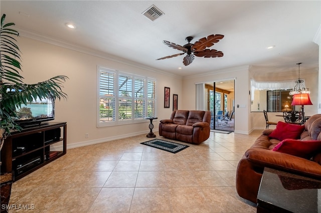 tiled living room with visible vents, baseboards, and crown molding