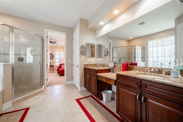 full bath with a stall shower, visible vents, ensuite bathroom, and a sink