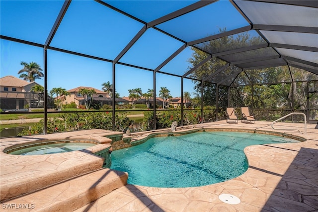 view of swimming pool with glass enclosure, a patio, and a pool with connected hot tub