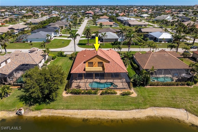 birds eye view of property featuring a residential view and a water view