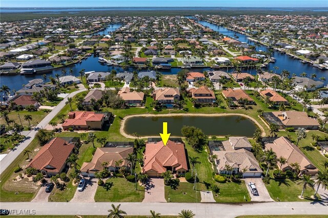 5220 SW 22nd Ave, Cape Coral, FL 33914 - aerial perspective of suburban area featuring a nearby body of water