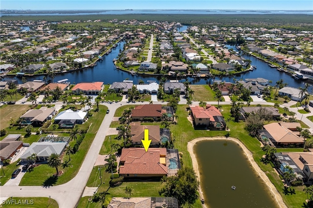 bird's eye view featuring a residential view and a water view