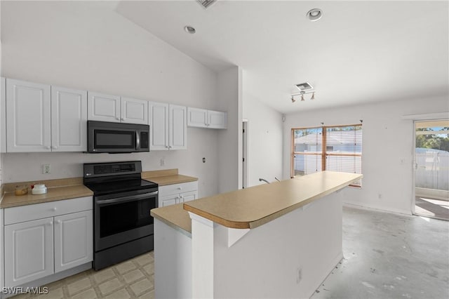 kitchen featuring a center island, white cabinetry, stainless steel range with electric cooktop, light countertops, and vaulted ceiling