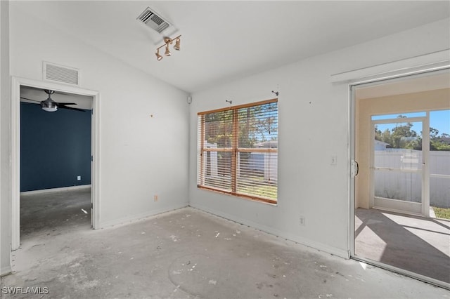 interior space with visible vents, baseboards, and vaulted ceiling