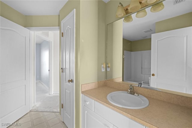 bathroom with vanity, tile patterned floors, and visible vents