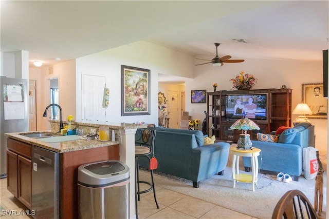 living room with vaulted ceiling, light tile patterned flooring, and ceiling fan