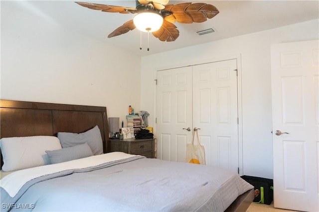 bedroom featuring a closet, visible vents, and a ceiling fan