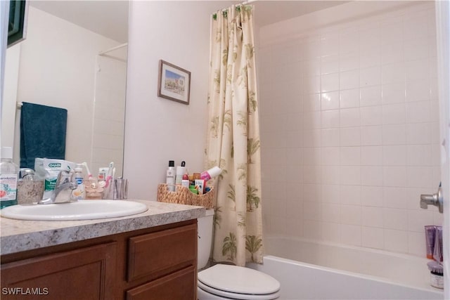 bathroom featuring shower / bath combination with curtain, toilet, and vanity