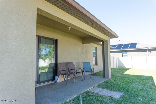 view of patio / terrace featuring fence