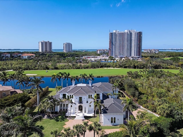 aerial view with a city view, a water view, and view of golf course