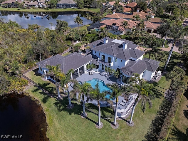 birds eye view of property with a residential view and a water view