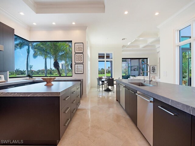 kitchen featuring coffered ceiling, a sink, stainless steel dishwasher, crown molding, and modern cabinets