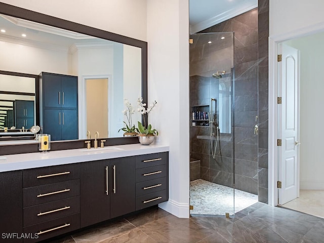 full bath featuring a shower stall, baseboards, ornamental molding, marble finish floor, and vanity