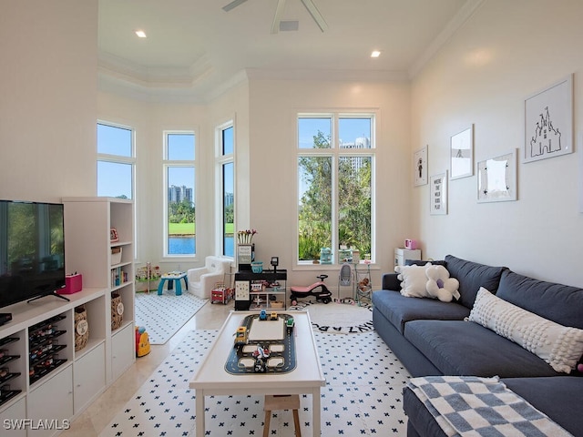 living room with recessed lighting, visible vents, a high ceiling, and crown molding