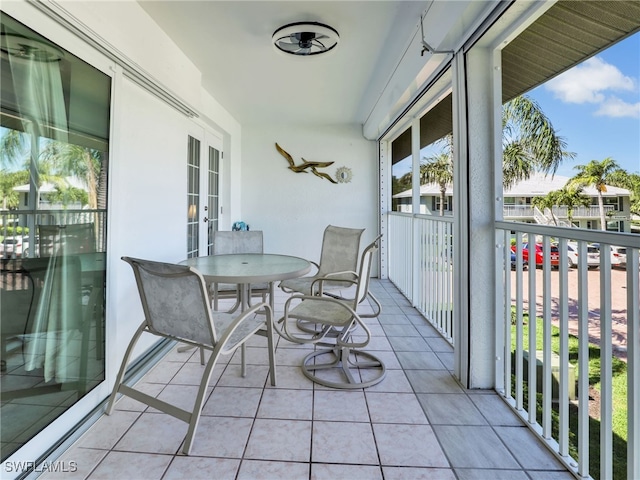 balcony featuring french doors and outdoor dining area