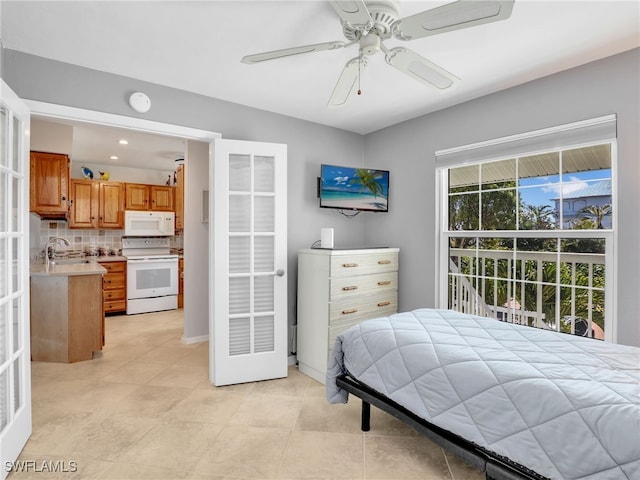 bedroom with a sink and ceiling fan