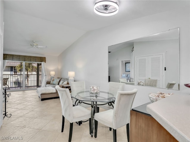 dining room with ceiling fan and lofted ceiling