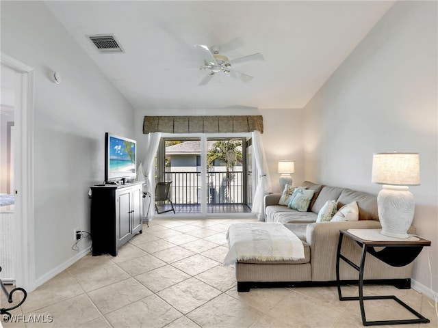 living room with visible vents, light tile patterned flooring, baseboards, ceiling fan, and vaulted ceiling