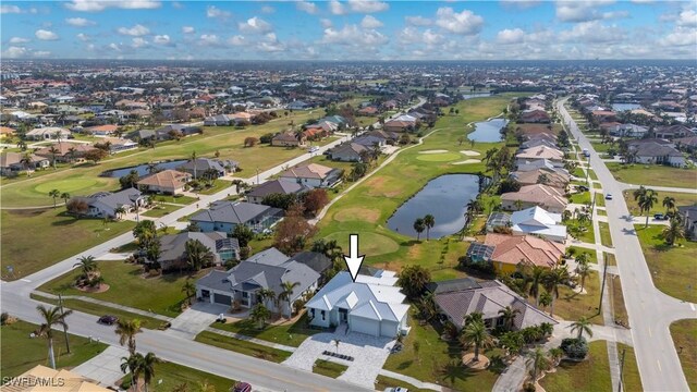 bird's eye view featuring view of golf course, a residential view, and a water view