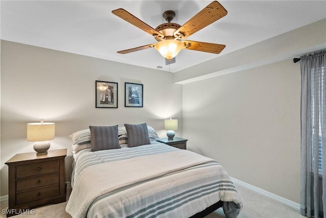 carpeted bedroom with baseboards and ceiling fan