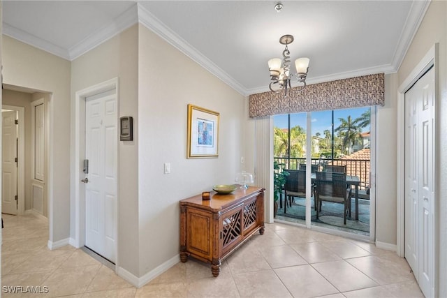 doorway with ornamental molding, light tile patterned flooring, baseboards, and a chandelier