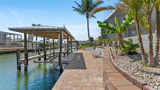 view of dock featuring boat lift and a water view